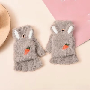 Detail of gray plush convertible gloves with bunny ears and carrot embroidery