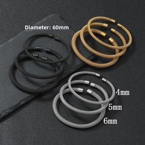 Detail of mesh wire bangles in black, gold, and silver with 4mm, 5mm, and 6mm thickness