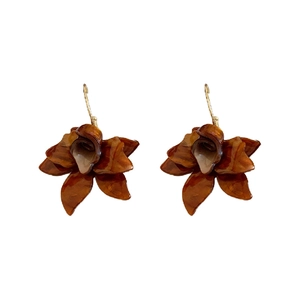 Maillard style amber resin flower earrings with gold metal hooks on white background