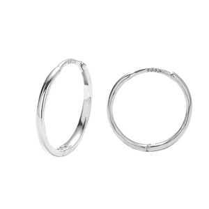Macro shot of silver 925 sterling silver hoop earrings with certified S925 hallmark