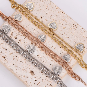 Three heart-shaped double-layer stainless steel bracelets in gold, rose gold and silver