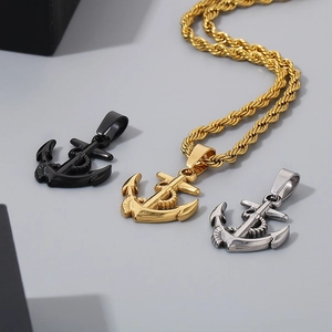 Detailed view of anchor pendant necklaces in gold, silver, and black polished steel