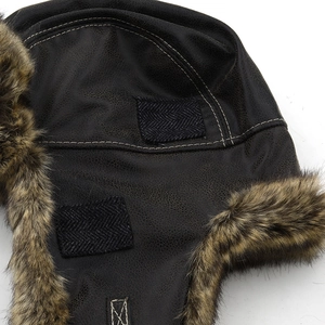 Winter faux leather trapper hat with warm faux fur lining and velcro strap closure