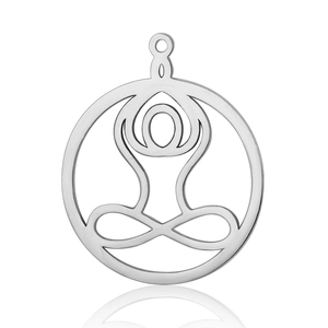 Macro detail of silver stainless steel yoga pendant with lotus pose design on white background
