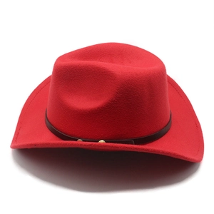 Detailed view of red felt cowboy hat featuring black decorative band and gold rivets