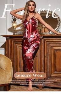 Detail of red floral satin loungewear set featuring V-neck camisole and long pants