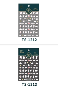 Close-up of 5D embossed nail stickers featuring cute white cats and clouds for nail art