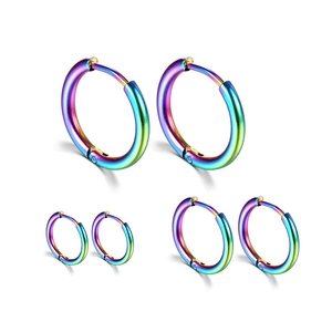 Detailed view of three pairs of rainbow stainless steel hoop earrings in various sizes