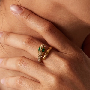 Elegant 18K gold plated snake ring with sparkling zircons and green emerald eyes