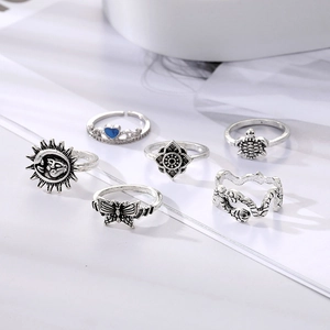 6-piece vintage silver ring set featuring butterfly, snake, and heart charms on white background