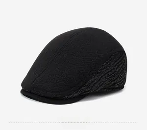 Detail view showing gray striped jacquard pattern on black wool blend winter flat cap for men