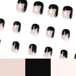 Short round black and nude wavy fluid press-on nail set in a neat matrix layout