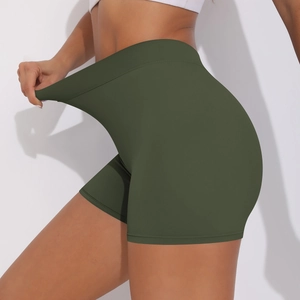 Detail showing the high elasticity of high-waisted olive green yoga shorts being stretched