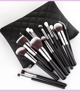 Detail of 15-piece makeup brush set with synthetic bristles and black quilted storage bag