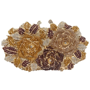 Macro shot of 3D rose luxury clutch with red crystals and gold leaf detail