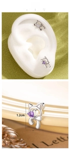Detail of cat stud earrings with heart-shaped purple zircon and crystal accents