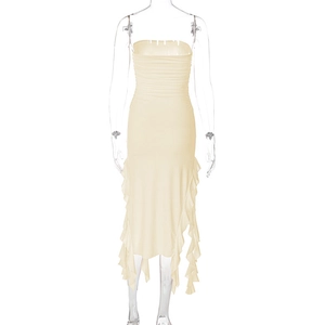 Detail of ruched bodice and ruffled hemline on a slim-fit cream tube dress