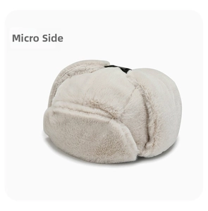 Detailed micro side view of plush faux fur winter trapper hat with black top buckle