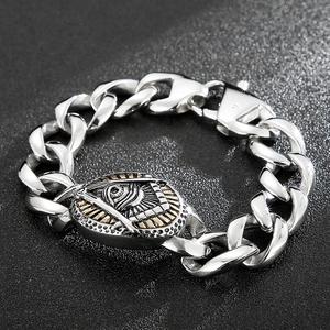 Vintage stainless steel Cuban link bracelet featuring a gothic skull and Eye of Providence