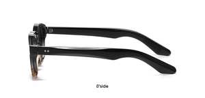 0-degree side view of black round frame sunglasses with tortoiseshell accents on white background