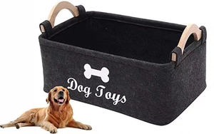 Detail of dark grey felt dog toy storage basket with wooden handles and bone logo