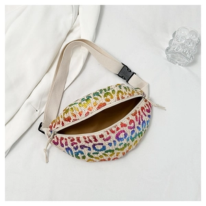 Detail of colorful leopard print woven fanny pack with adjustable strap and buckle
