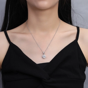 Close-up of 2 carat square zircon pendant necklace on model showing elegant fit