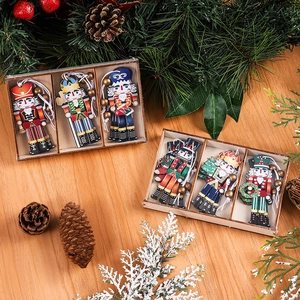 Macro view of wooden nutcracker ornaments set with pine cones and festive tree decorations