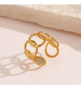 Macro shot of gold-plated interlocking oval rings with a geometric minimalist finish