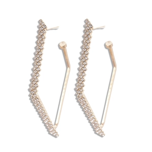 Geometric diamond-set gold stud earrings with wavy edges for a luxury minimalist look