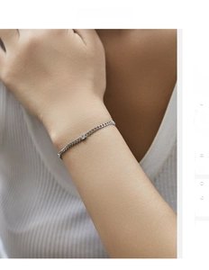 Detailed view of a minimalist S925 silver bracelet with a single sparkling VVS1 moissanite