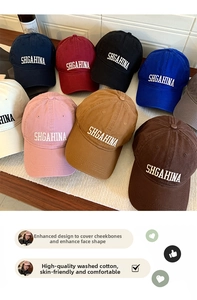 Detailed flat lay of premium washed cotton baseball caps with SHGAHINA embroidery