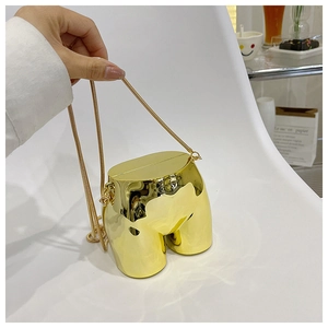 Artistic torso-shaped gold metal handbag with shiny finish and delicate snake chain
