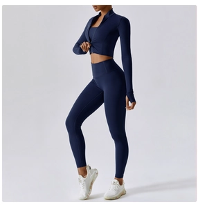 Three-piece navy blue yoga set featuring a zip jacket, sports bra, and high-waisted leggings
