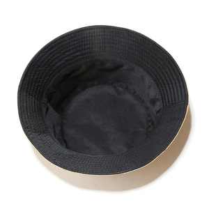 Detail view of the black cotton inner lining and stitched construction of the bucket hat