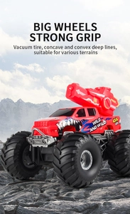 Detail of red shark-themed RC truck with deep tread tires on rocky terrain for all-terrain play