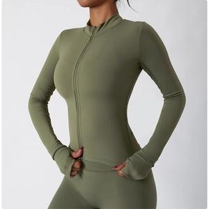 Detail of olive green yoga jacket featuring a stand collar zipper and thumbhole cuffs
