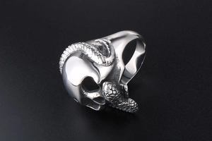 Detailed view of punk skull and snake ring with intricate 3D stainless steel carving