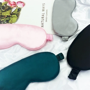 Silky sleep masks in pink, grey, green and black colors with elastic headbands