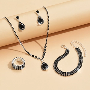 Elegant silver jewelry set with sparkling black teardrop crystals and matching ring