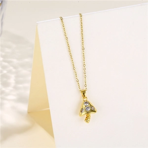Close-up of golden mushroom pendant necklace with sparkling micro-inlaid zircon stones