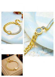 Detailed macro view of a gold-plated titanium bracelet with zircon stones and roman numerals