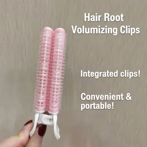 Pink and white hair root volumizing clip for daily styling shown in hand display