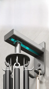Macro view of adjustable telescopic kitchen rail with sliding hooks in gunmetal finish