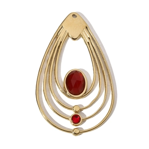 Detail of gold teardrop pendant with red gemstones on a minimalist stainless steel charm