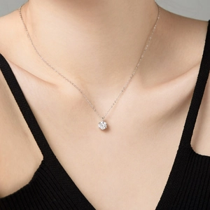 Close-up of minimalist S925 sterling silver necklace with large round-cut cubic zirconia
