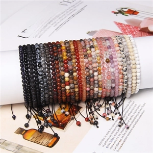 Close-up of 4mm adjustable natural stone bead bracelets with woven cord and yoga style