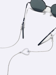 Silver eyewear chain with heart pendant and non-slip loops for stylish sunglasses