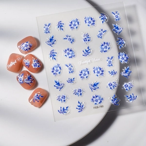 Detailed blue floral nail stickers with porcelain style on transparent background