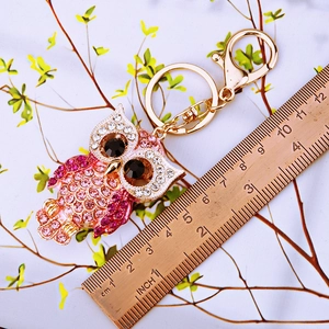 Pink rhinestone owl car keychain in gold metal with lobster clasp and sizing ruler